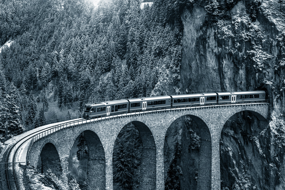 treated-blue_6 A train going over a viaduct