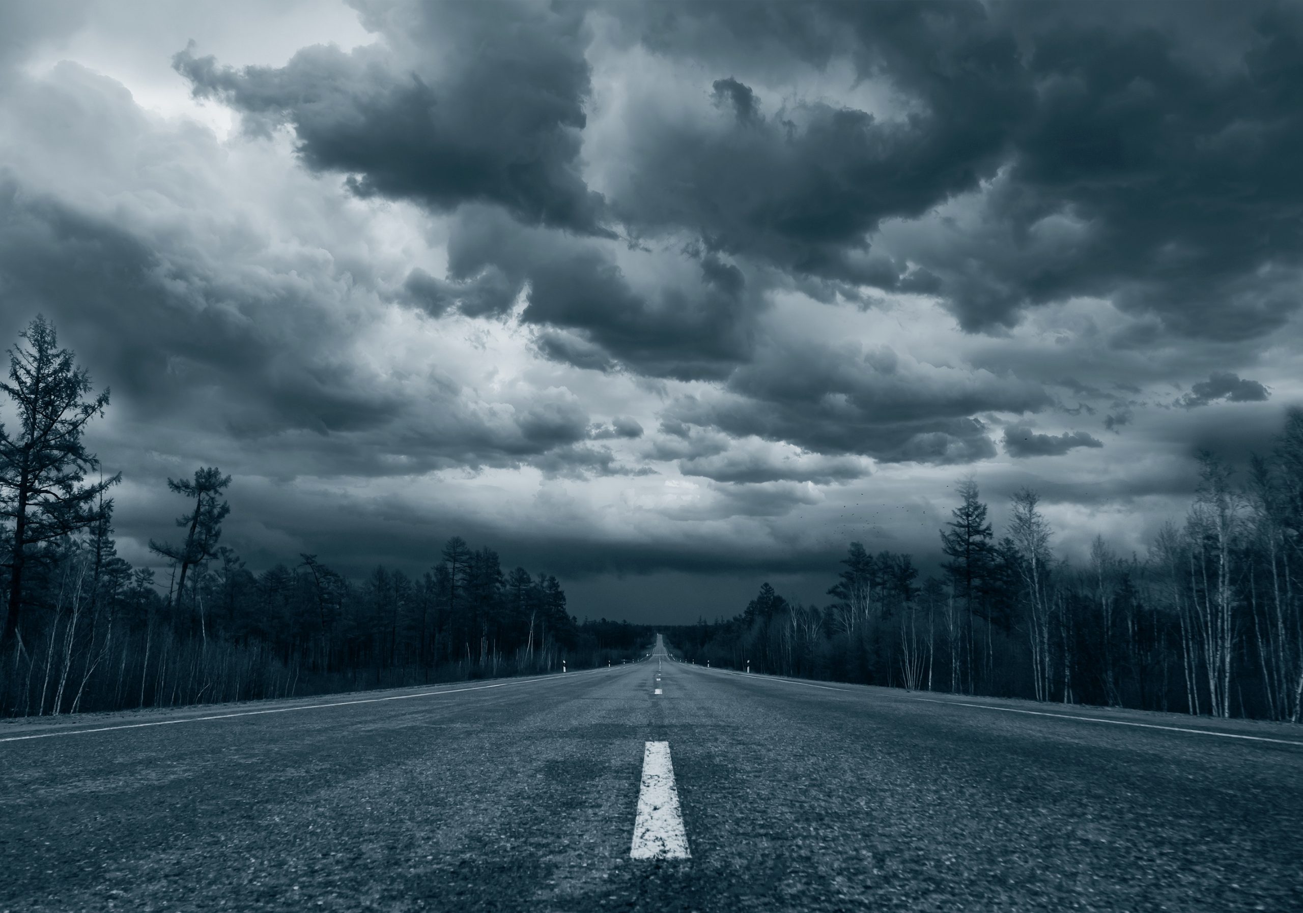 treated-blue_2 A road with stormy clouds